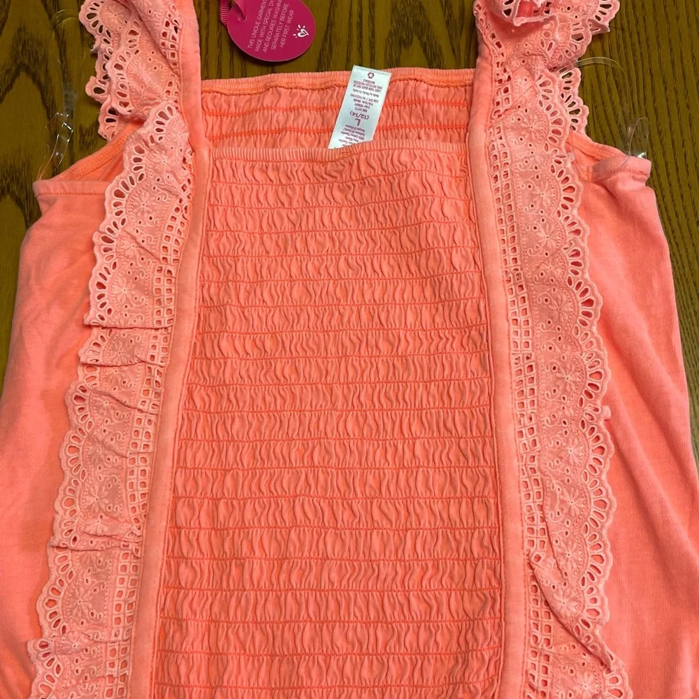 New Justice Girls orange smocked ruffle orange dye top. Size L 12/14